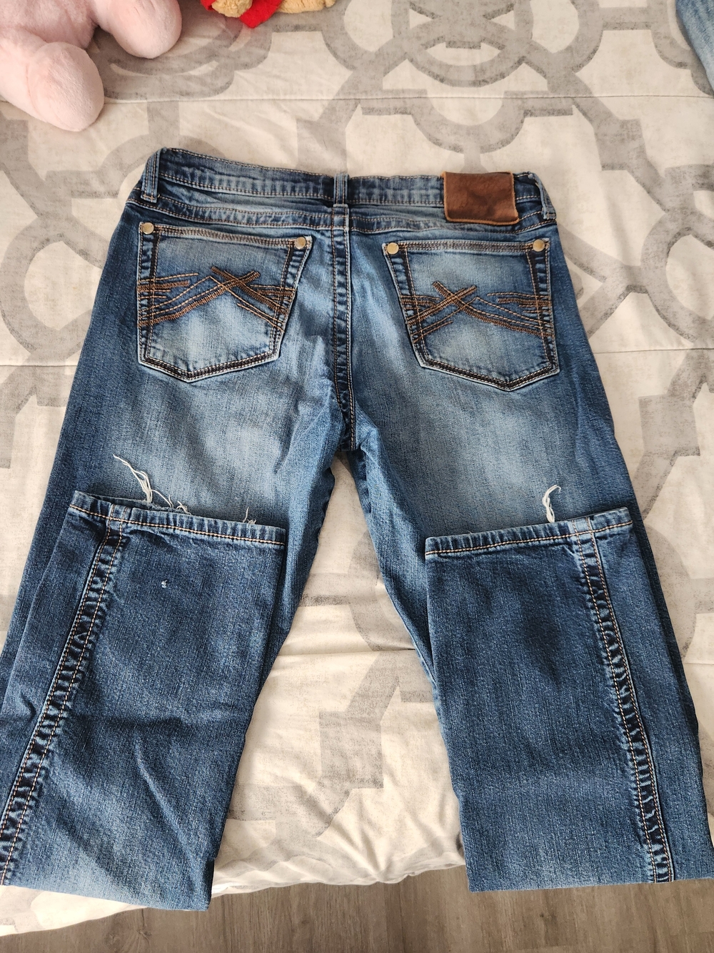 Wrangler Medium Blue Relaxed Fit Jeans with Brown Patch